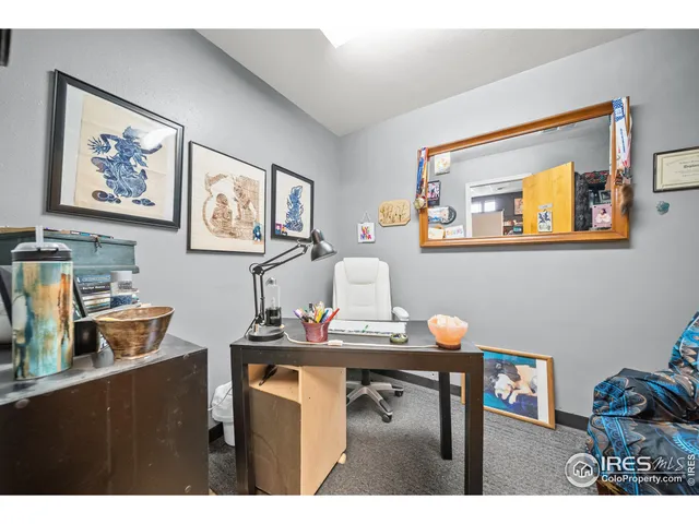 a view of a workspace with furniture