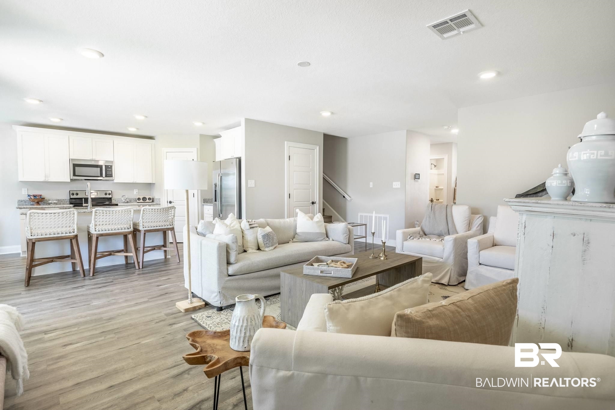 12918 Flanagan Street Elberta, AL 36530 - Photo 13 of 33 Open-concept living space featuring wood-finish flooring, recessed lighting, and a neutral color palette