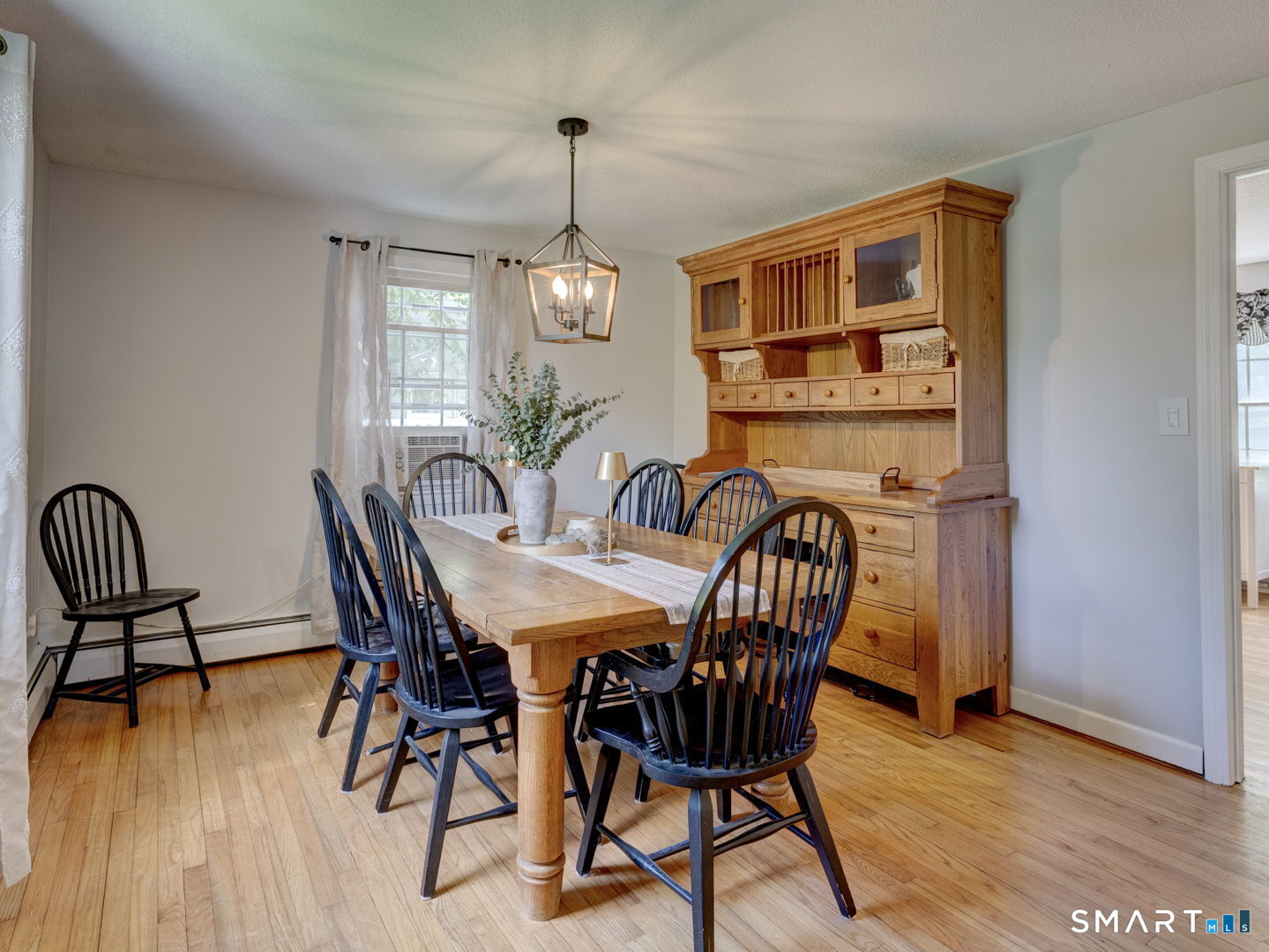 39 Freedom Drive Canton, CT 06019 - Photo 8 of 37 a view of a dining room with furniture window and wooden floor