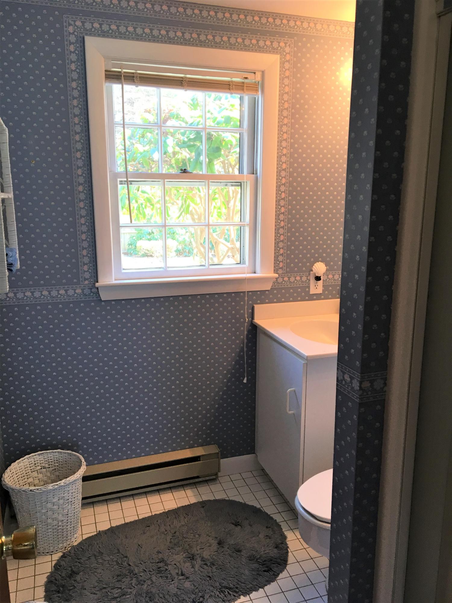 84 Uncle Edwards Road Mashpee, MA 02649 - Photo 16 of 22 a bathroom with a sink toilet and window