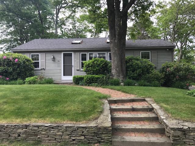 84 Uncle Edwards Road Mashpee, MA 02649 - Photo 3 of 22 a front view of a house with a yard