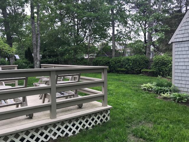 84 Uncle Edwards Road Mashpee, MA 02649 - Photo 5 of 22 a view of backyard with seating and green space