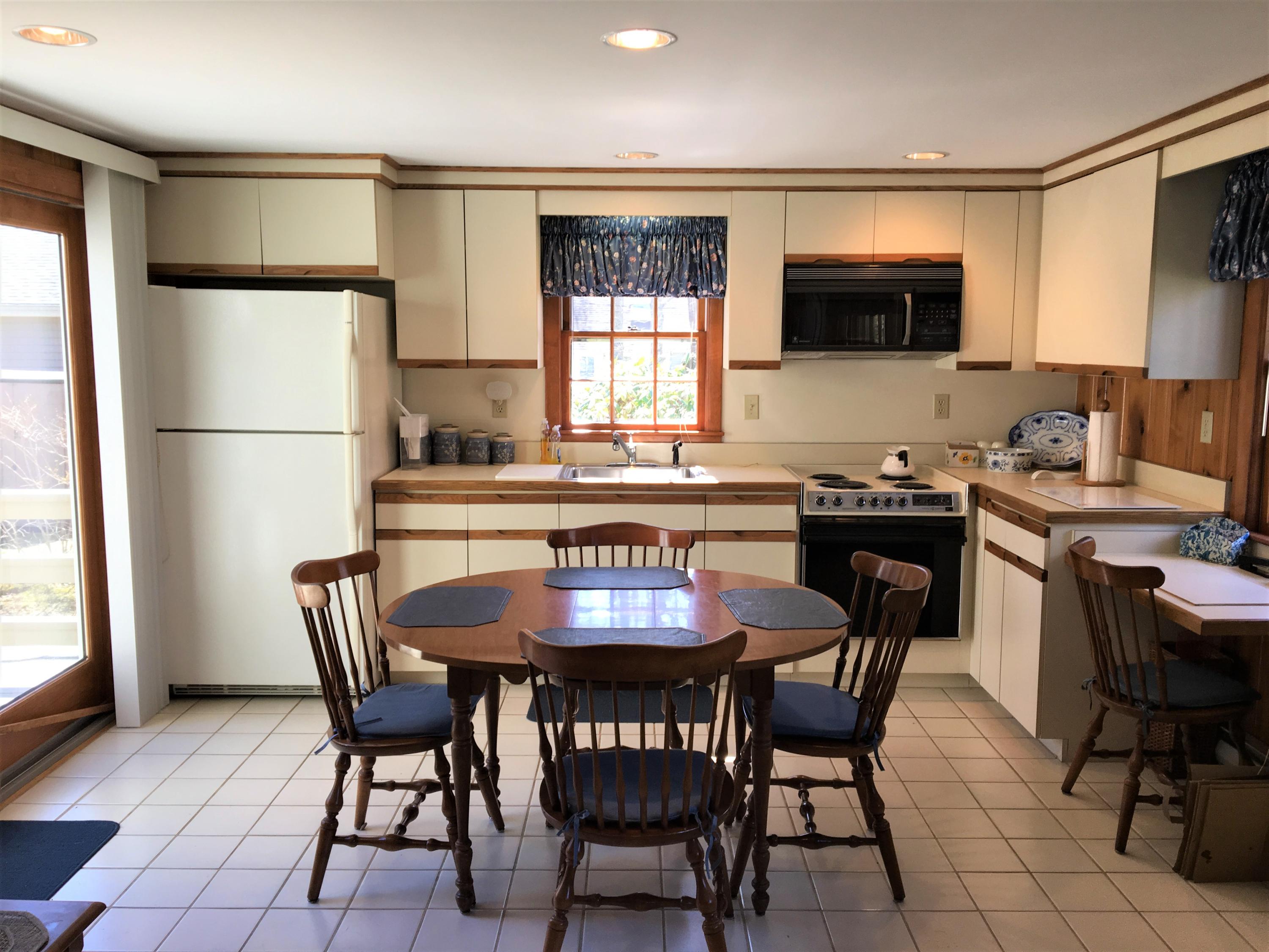 84 Uncle Edwards Road Mashpee, MA 02649 - Photo 10 of 22 a view of a dining room with furniture
