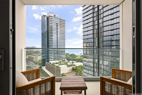 a view of a balcony with wooden floor