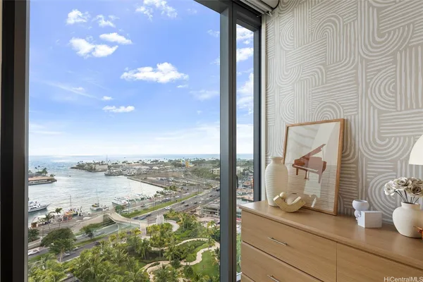 a view of living room with furniture and lamp