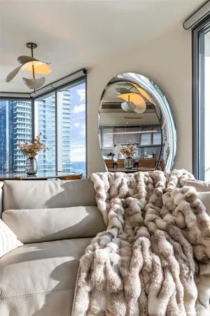 a living room with a large window and a table