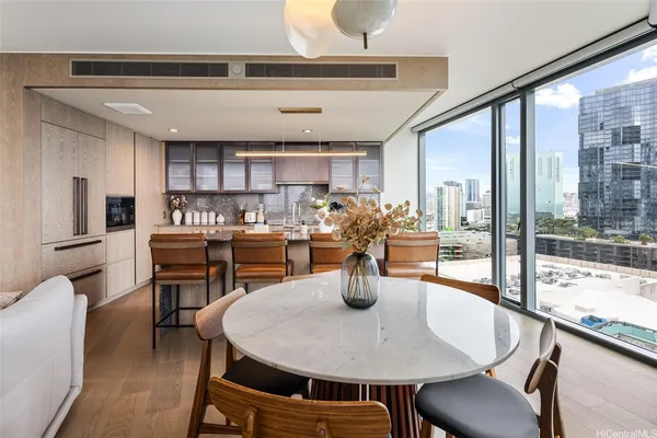 a dining room with a table or chairs and a dining table with wooden floor