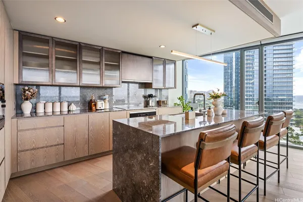 a kitchen with appliances cabinets and a counter top space