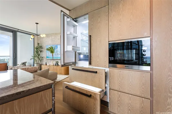 a kitchen with a sink and a refrigerator
