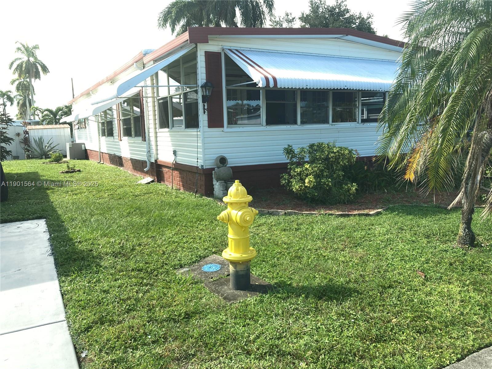 1891 Southwest 84th Avenue Davie, FL 33324 - Photo 2 of 16 a house view with a garden space