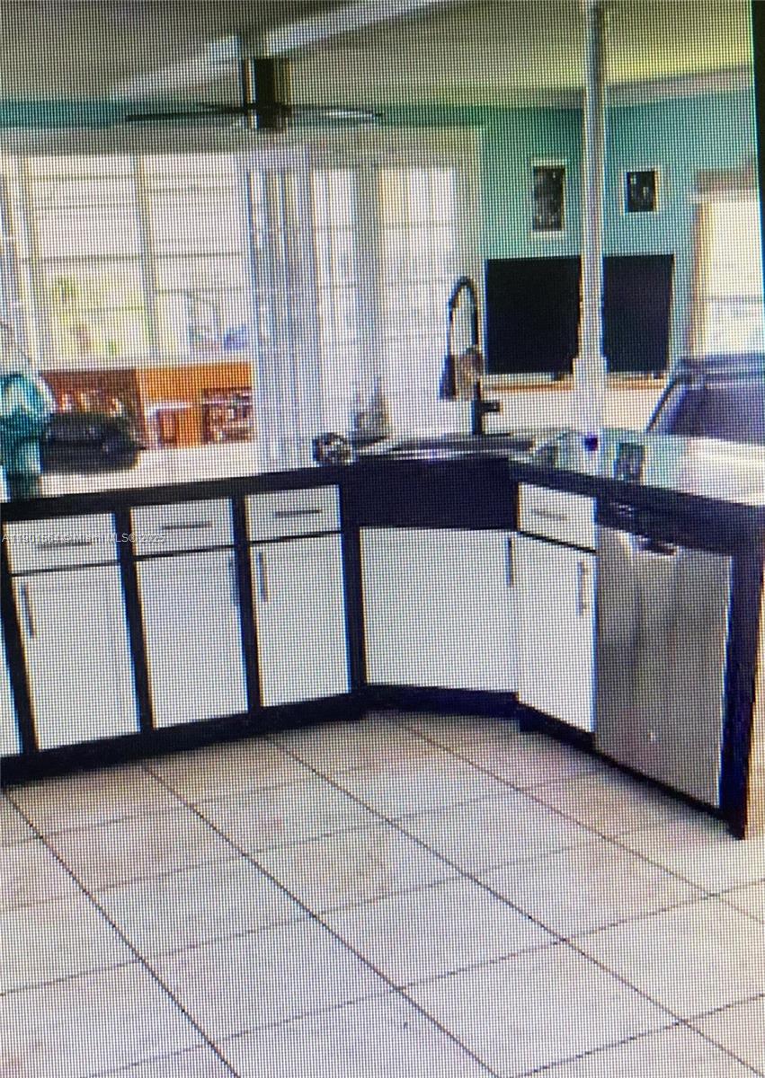 1891 Southwest 84th Avenue Davie, FL 33324 - Photo 7 of 16 a kitchen with stainless steel appliances a sink and a counter