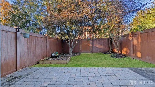 a small garden in the corner of a house