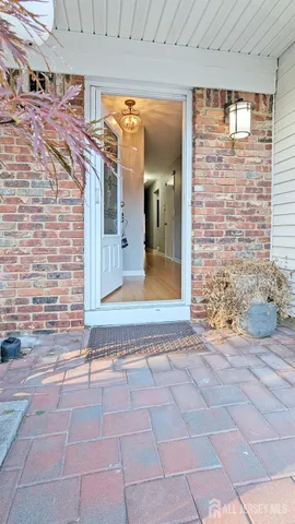 a view of a brick house with outdoor space