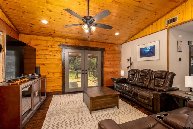 a media room with lots of chairs and a projector