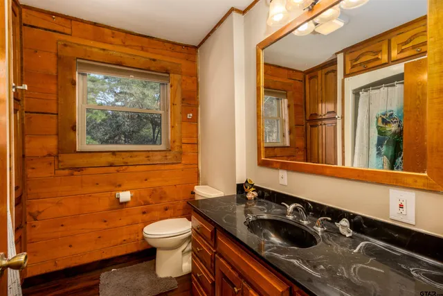a workspace with wooden floor and a window