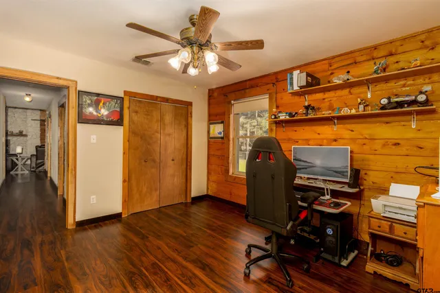 a view of a dining room with furniture and wooden floor