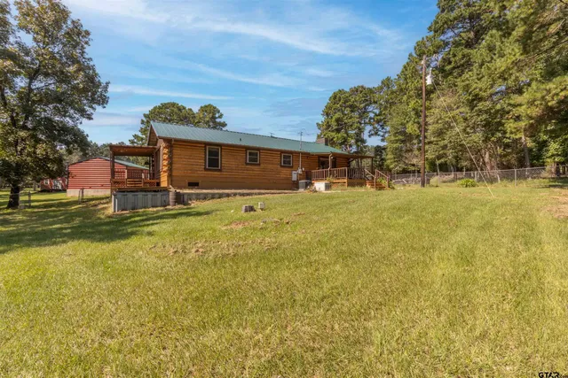 a view of a swimming pool with patio