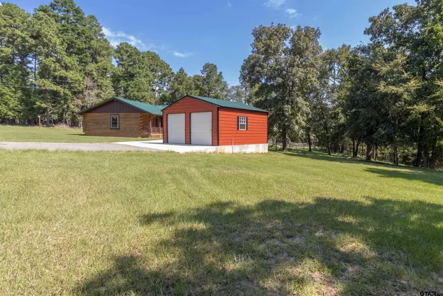 a view of a chairs and table in the balcony