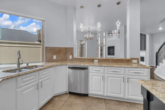 a kitchen with cabinets and sink