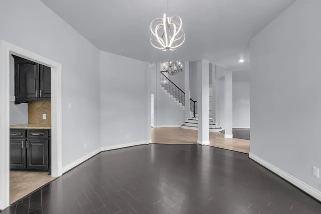 a view of wooden floor and windows in a room