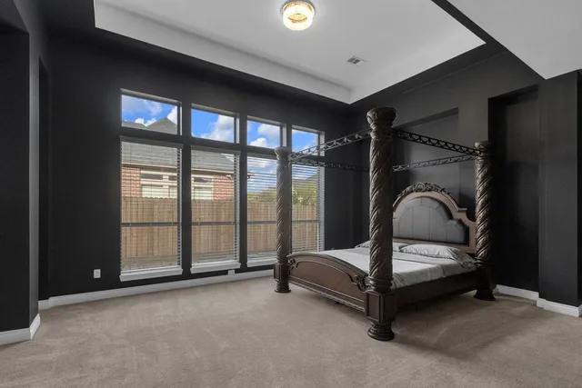 a view of a living room with wooden floor and stairs