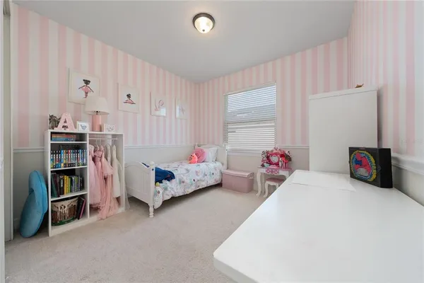 a bed room with a bed and a book shelf