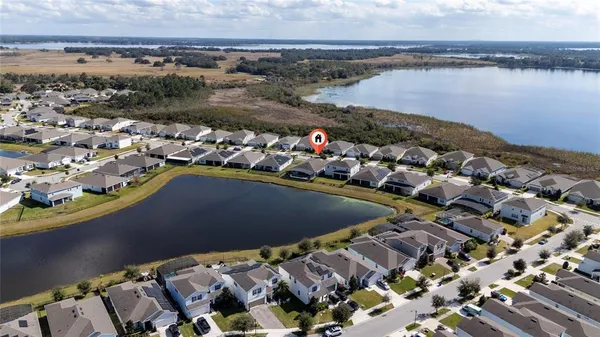 an aerial view of a house with a ocean view