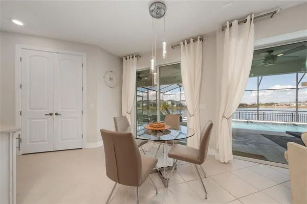 a dining room with furniture and a window