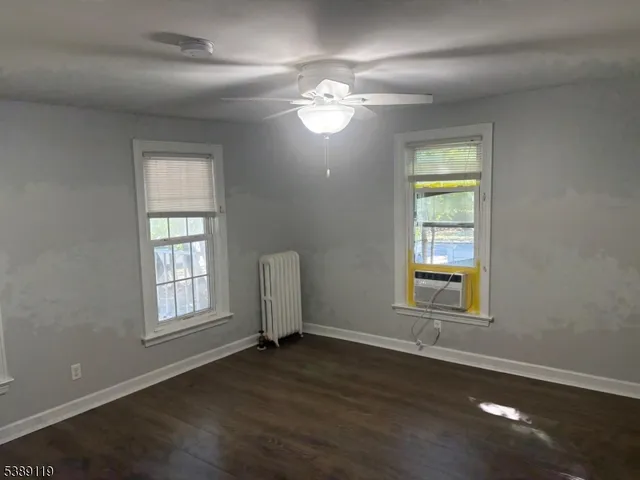 wooden floor and windows in an empty room