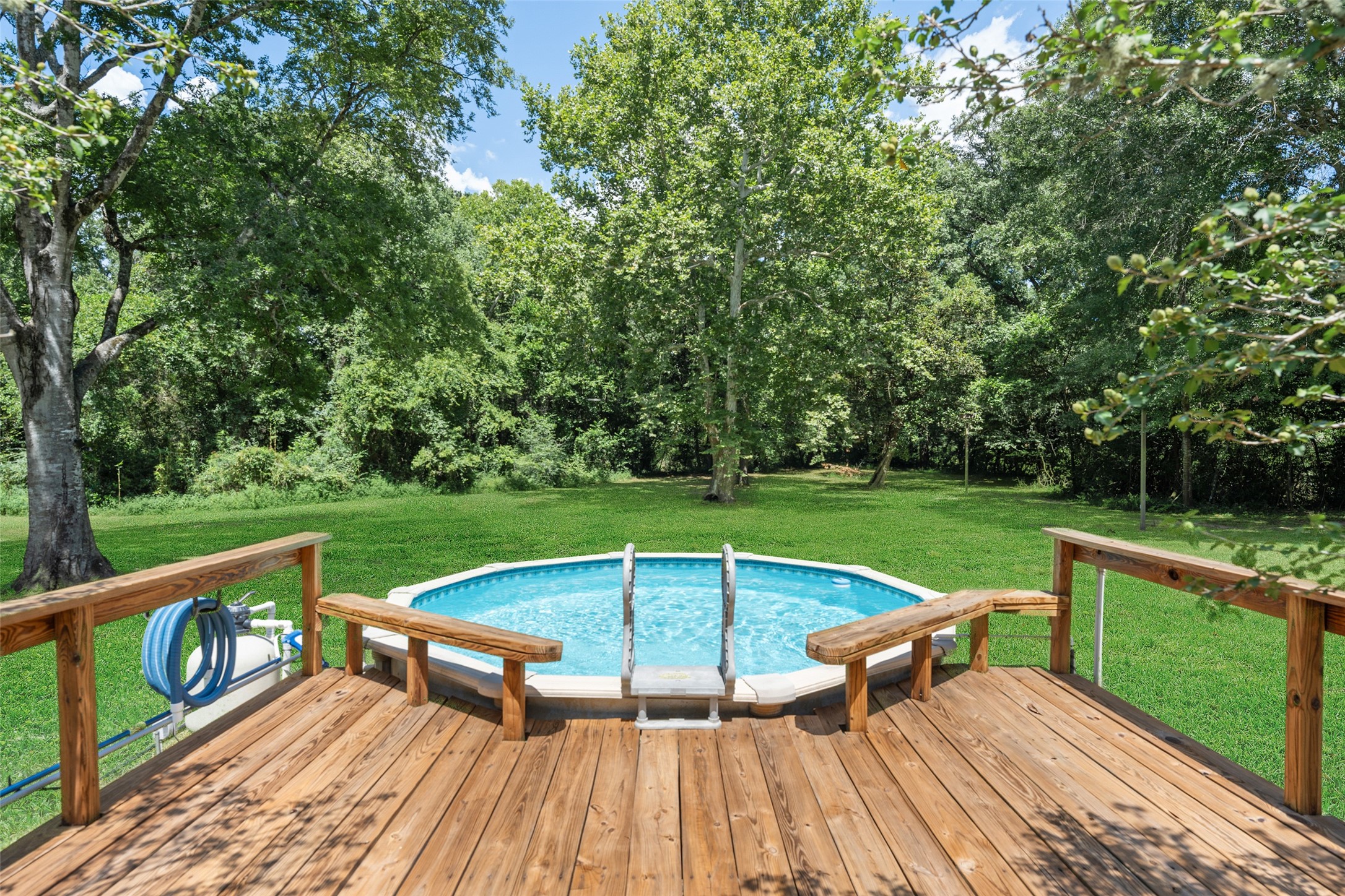 10291 Hart Road Conroe, TX 77306 - Photo 4 of 23 Cool off in the sparkling pool and play some outdoor games with friends and family.
