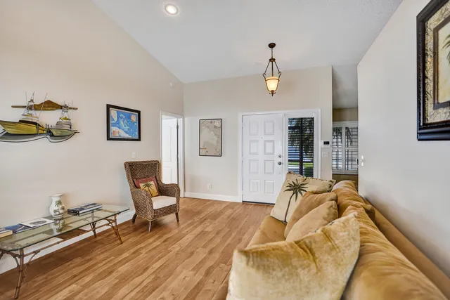 a bedroom with a bed and large window