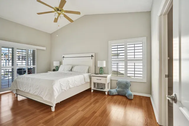 a bathroom with a granite countertop sink mirror and a bathtub