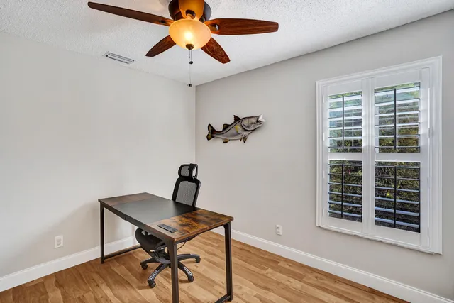 a bedroom with furniture and a window