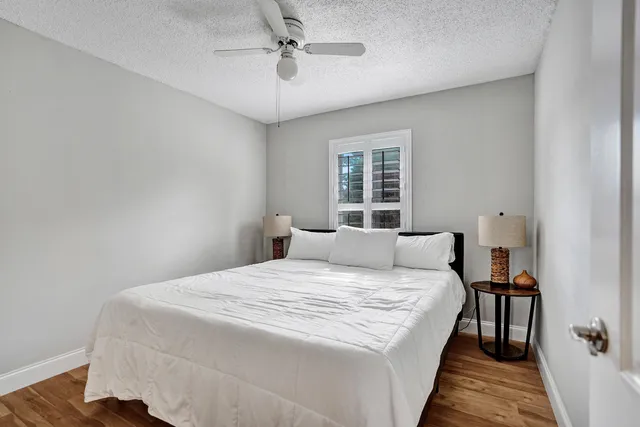 a kitchen with stainless steel appliances a dining table chairs and granite counter tops