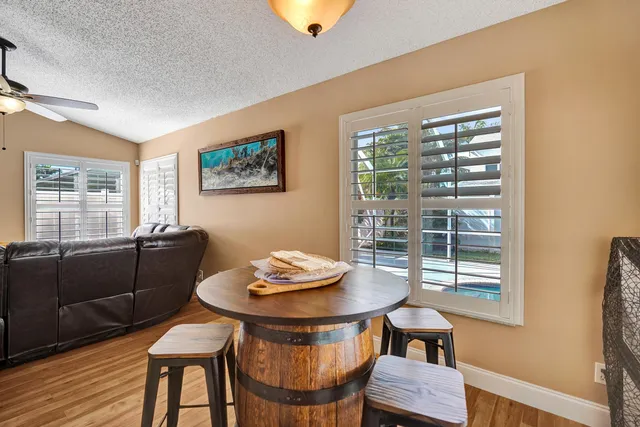 a kitchen with stainless steel appliances granite countertop a refrigerator stove and cabinets