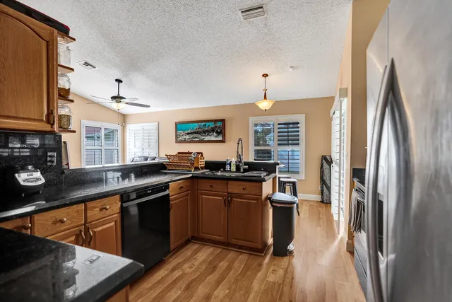 a view of a swimming pool with a patio