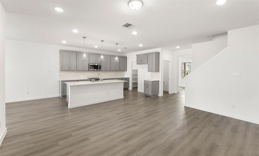1008 Colgate Circle Princeton, TX 75407 - Photo 17 of 29 a view of kitchen with wooden floor