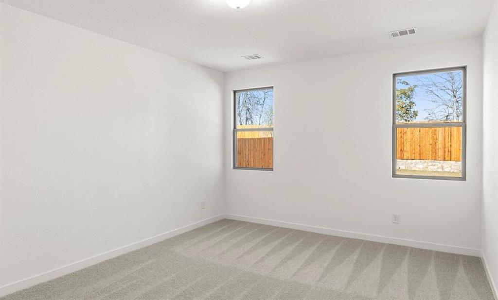 1008 Colgate Circle Princeton, TX 75407 - Photo 18 of 29 an empty room with a window