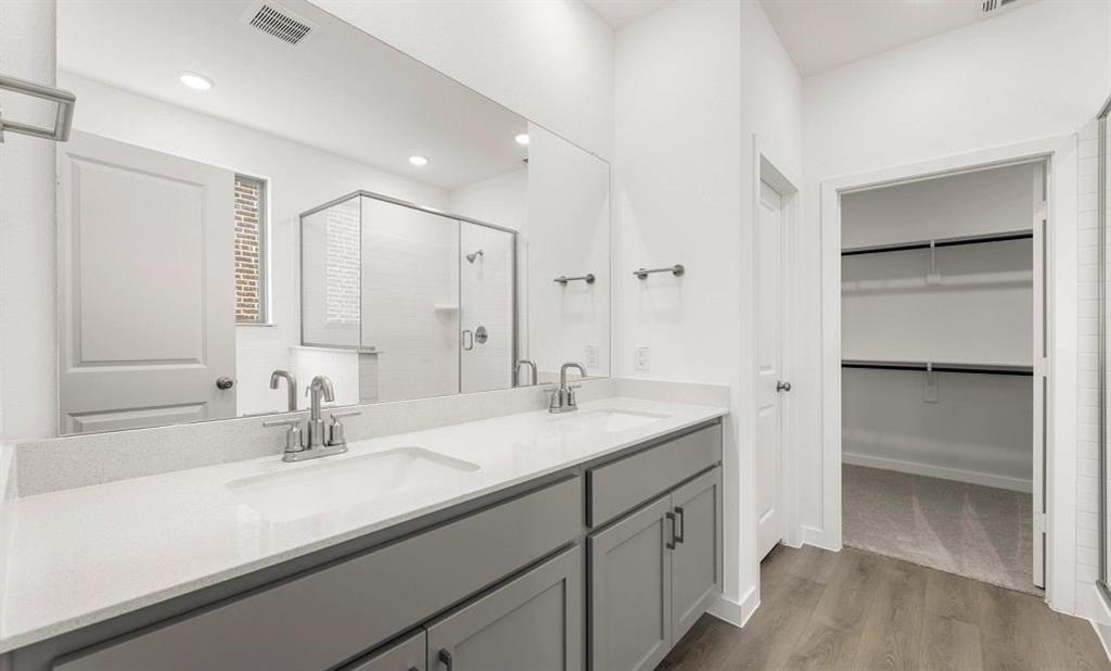 1008 Colgate Circle Princeton, TX 75407 - Photo 20 of 29 a bathroom with a sink and a mirror