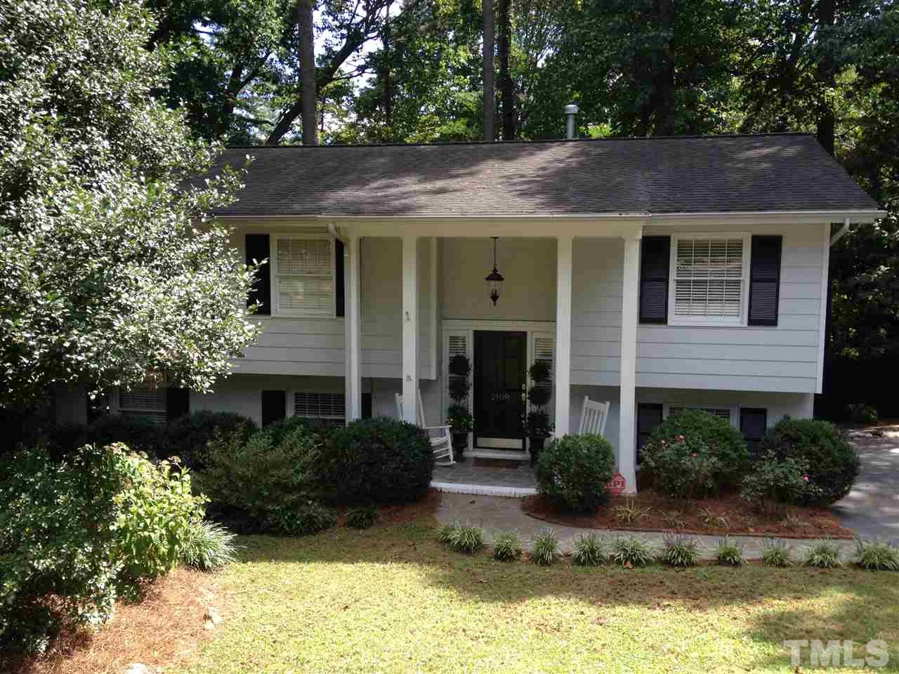 2109 Hillock Drive Raleigh, NC 27612 - Photo 2 of 23 a view of a house with a yard plants and large tree