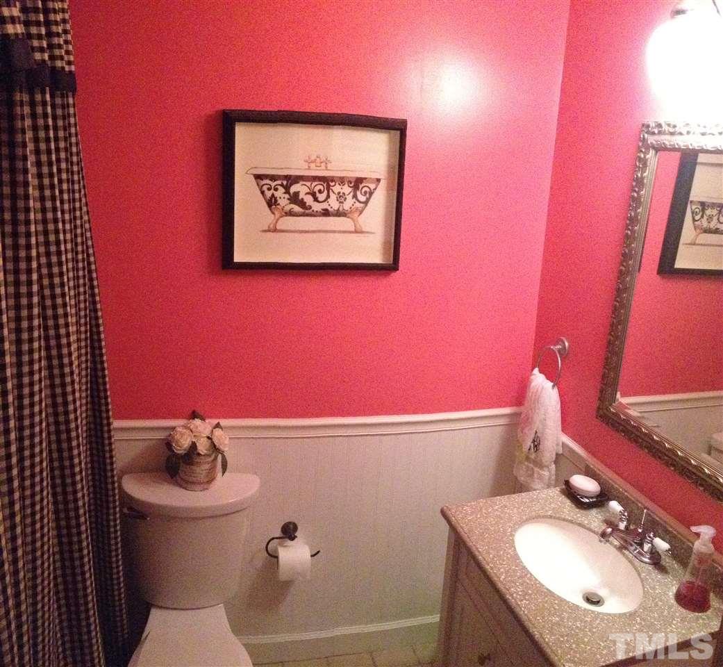 2109 Hillock Drive Raleigh, NC 27612 - Photo 13 of 23 a bathroom with a sink a toilet and mirror