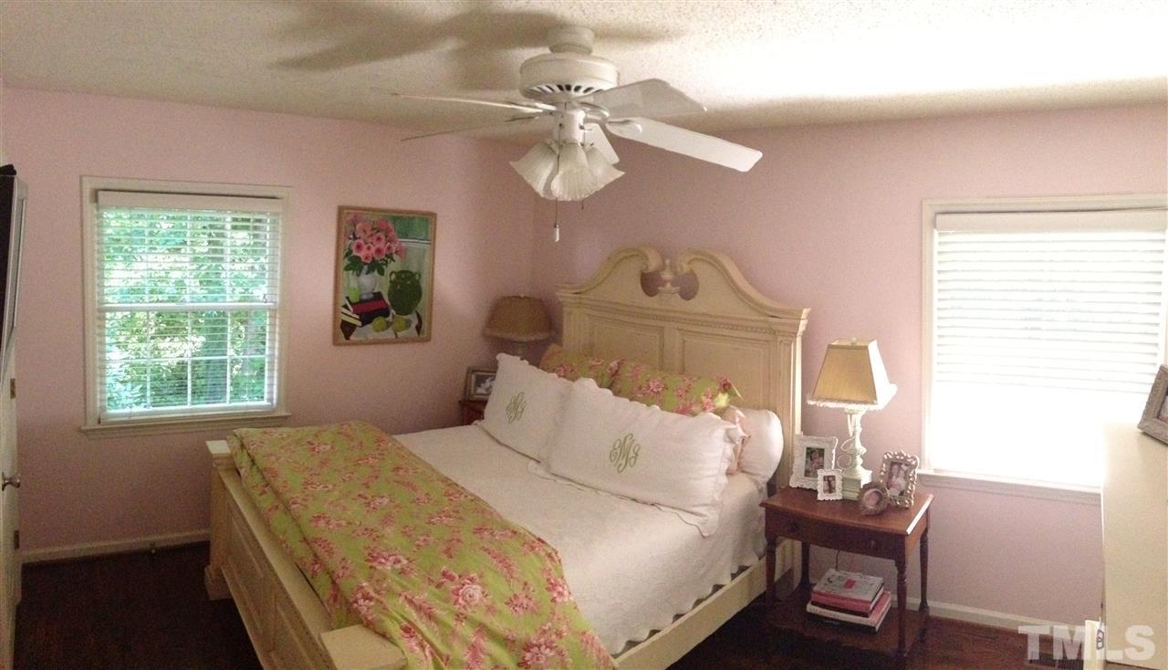 2109 Hillock Drive Raleigh, NC 27612 - Photo 14 of 23 a bedroom with a bed and a window