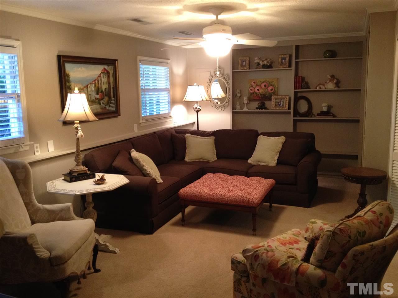 2109 Hillock Drive Raleigh, NC 27612 - Photo 16 of 23 a living room with furniture and a lamp