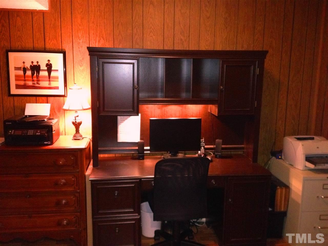 2109 Hillock Drive Raleigh, NC 27612 - Photo 18 of 23 a living room with furniture and a flat screen tv