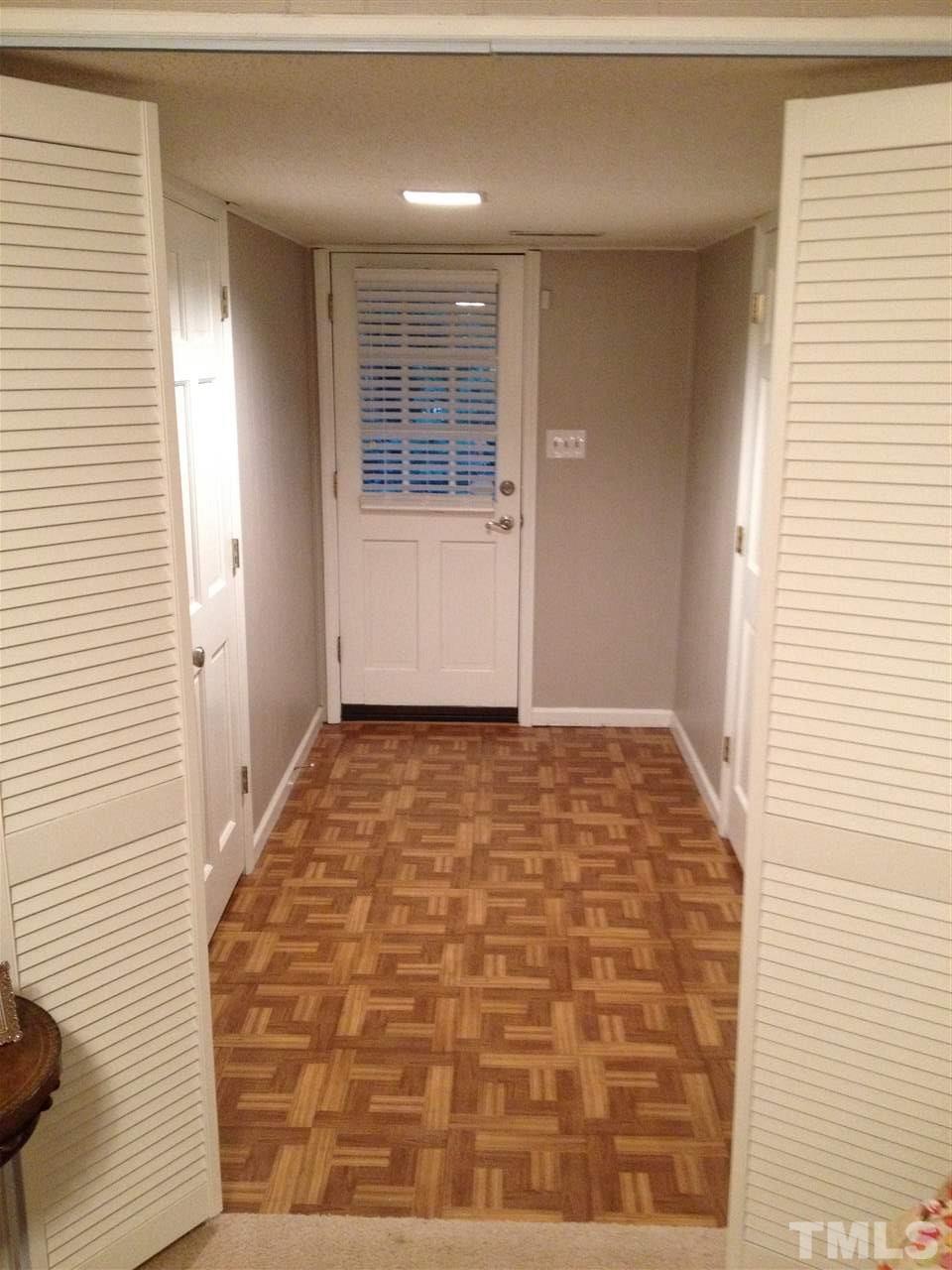 2109 Hillock Drive Raleigh, NC 27612 - Photo 19 of 23 a view of hallway with wooden floor