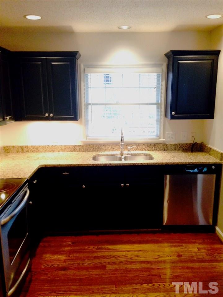 2109 Hillock Drive Raleigh, NC 27612 - Photo 8 of 23 a kitchen with a sink and a microwave