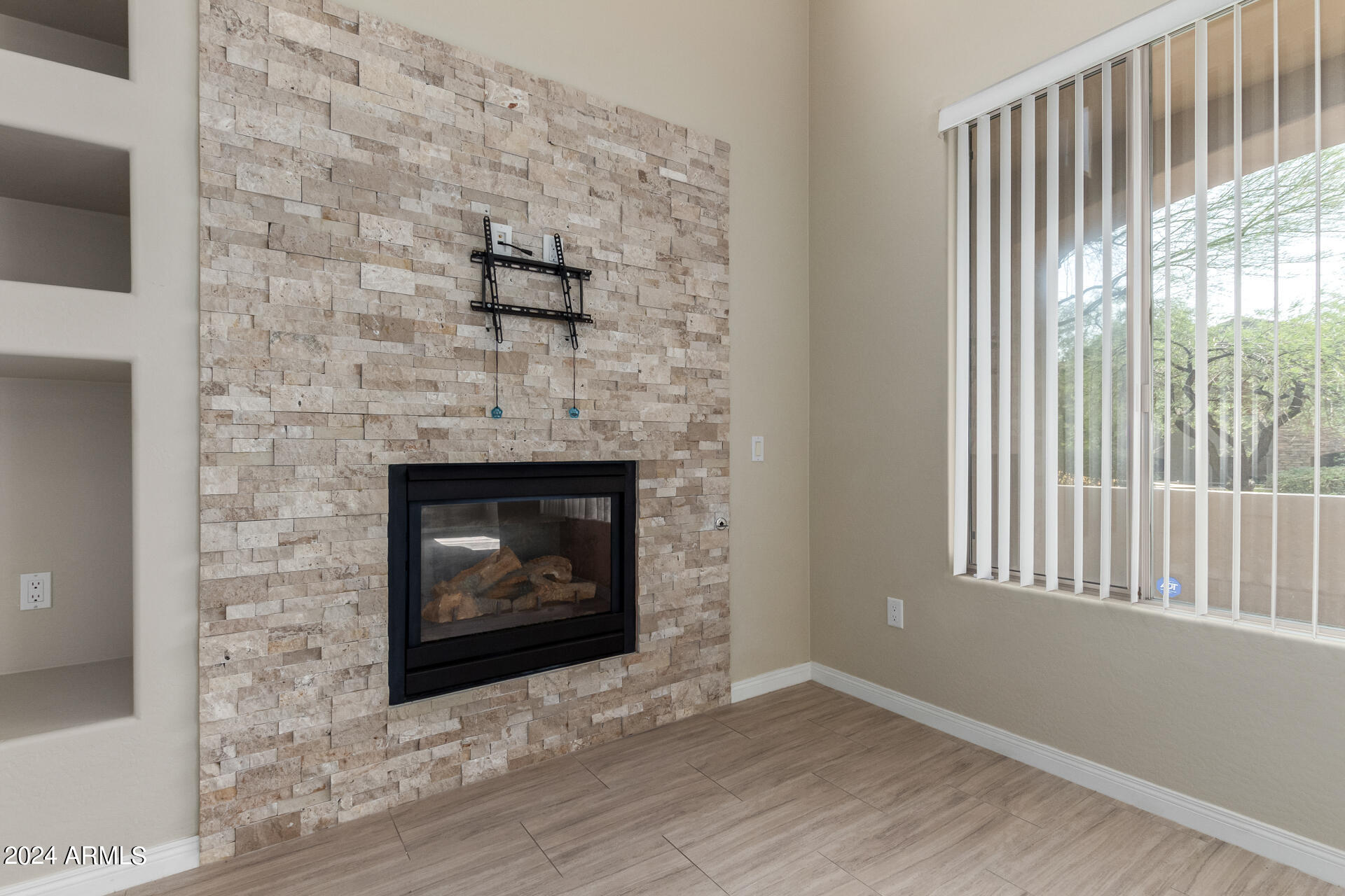 19475 North Grayhawk Drive, Unit 1100 Scottsdale, AZ 85255 - Photo 12 of 54 a living room with a fireplace in it