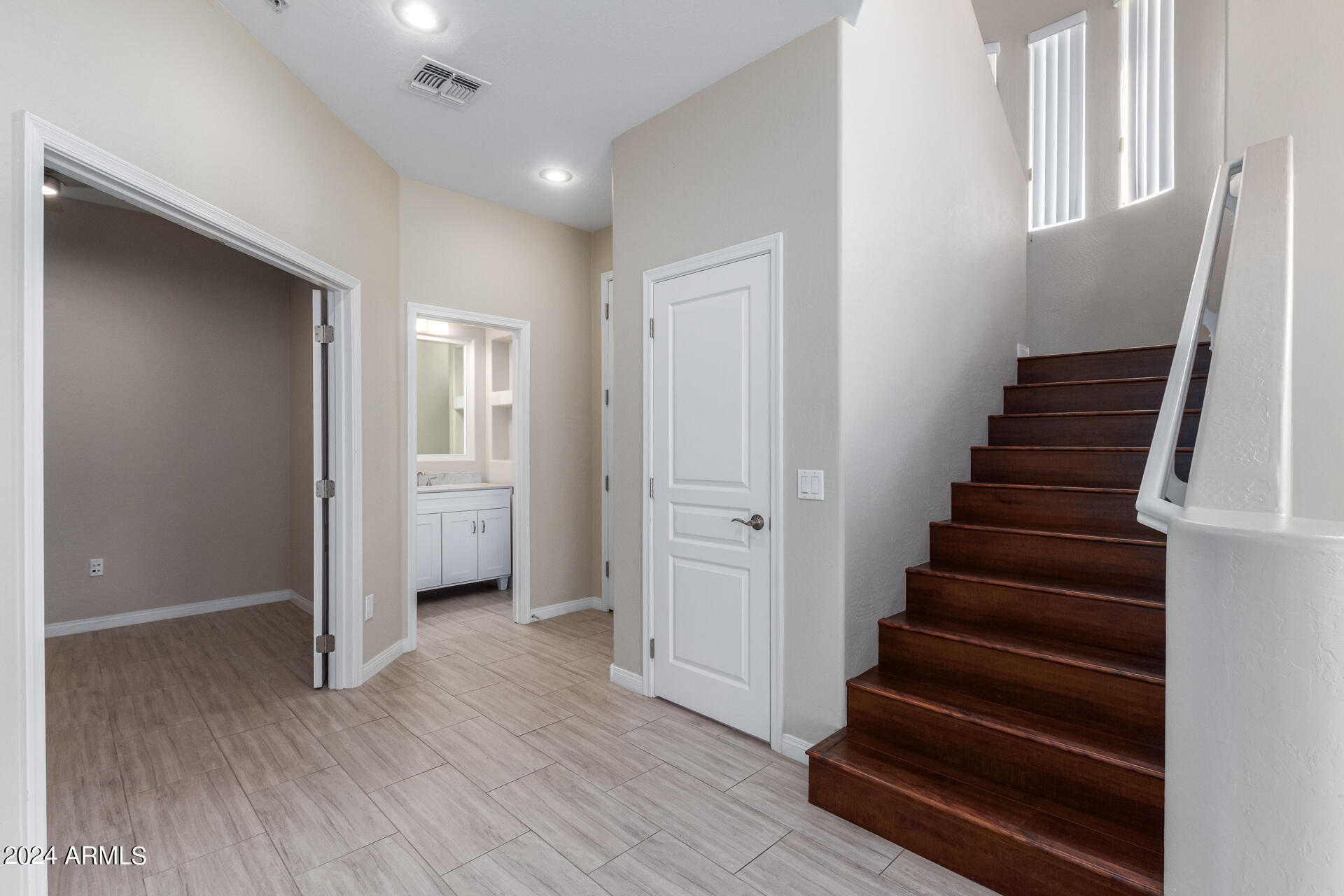 19475 North Grayhawk Drive, Unit 1100 Scottsdale, AZ 85255 - Photo 13 of 54 a view of entryway with wooden floor and stairs