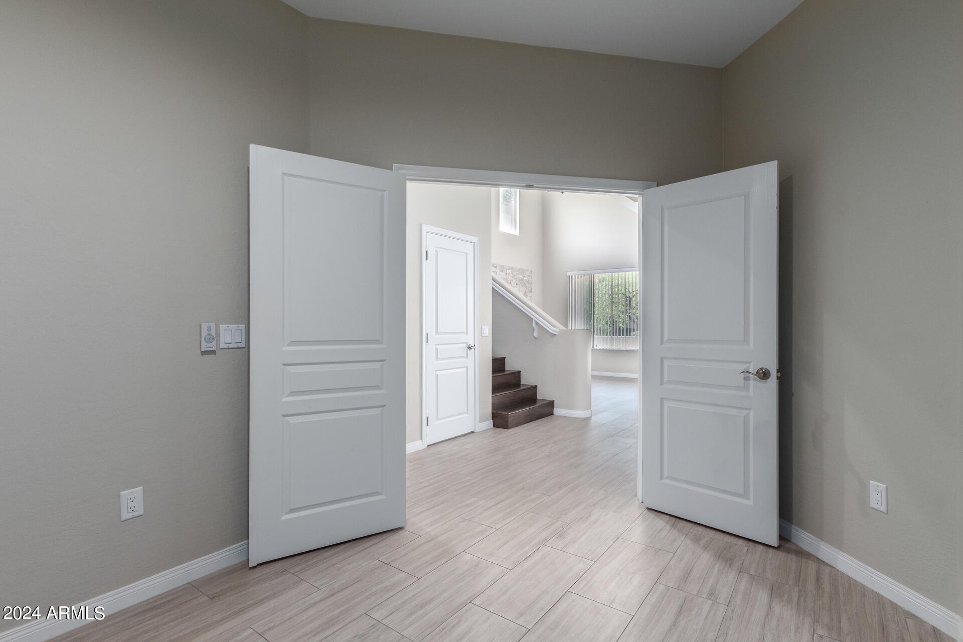 19475 North Grayhawk Drive, Unit 1100 Scottsdale, AZ 85255 - Photo 14 of 54 an empty room with wooden floor closet and windows