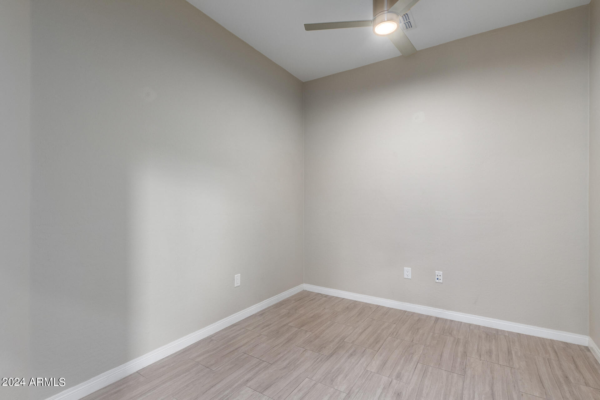19475 North Grayhawk Drive, Unit 1100 Scottsdale, AZ 85255 - Photo 15 of 54 a view of an empty room with wooden floor